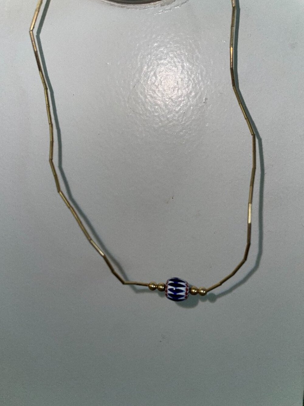 Necklace with white & blue beaded pendant